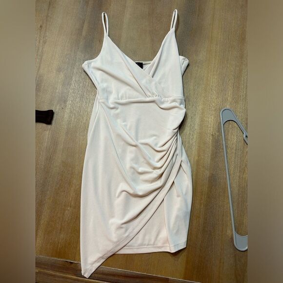 None Dresses & Skirts - Cream, mini wrap dress. Never worn new with tags in perfect condition.